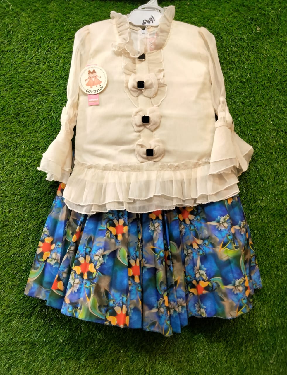 Girls Cream Ruffle Top with Bow Buttons & Blue Floral Pleated Skirt Stylish Party Wear Dress Set | Elegant & Comfortable Outfit